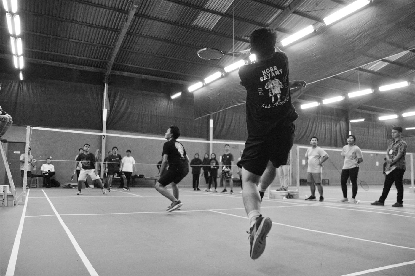 Badminton match in progress
